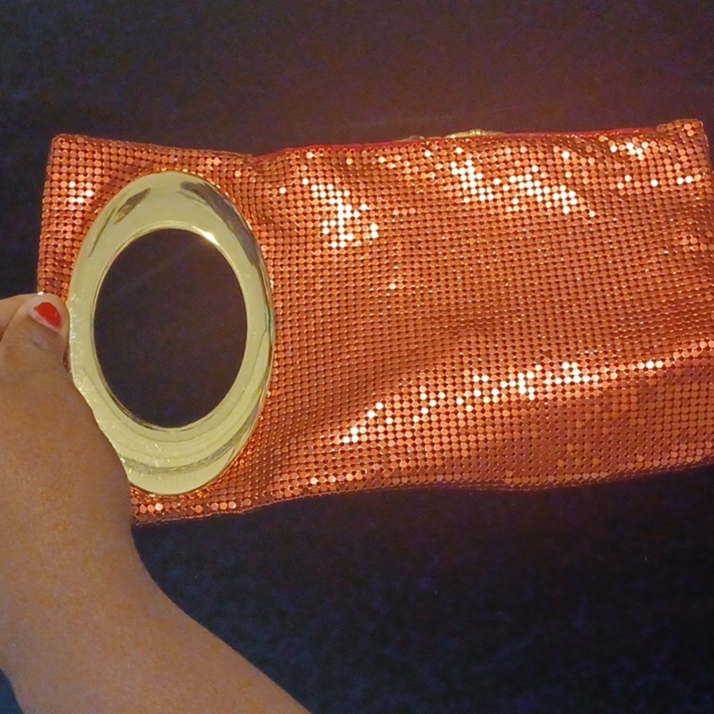 Pink sequence clutch.